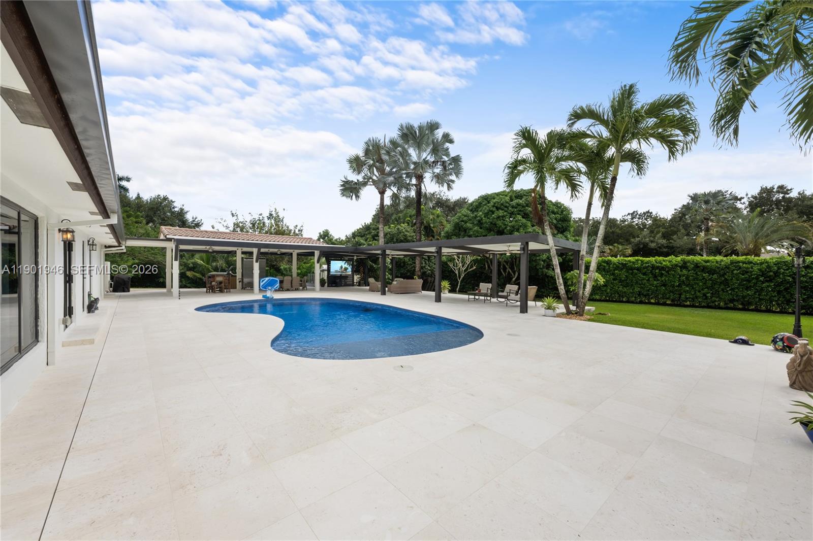15110 North Saxon Circle Southwest Ranches, FL 33331 - Photo 29 of 45 a view of a swimming pool with a patio