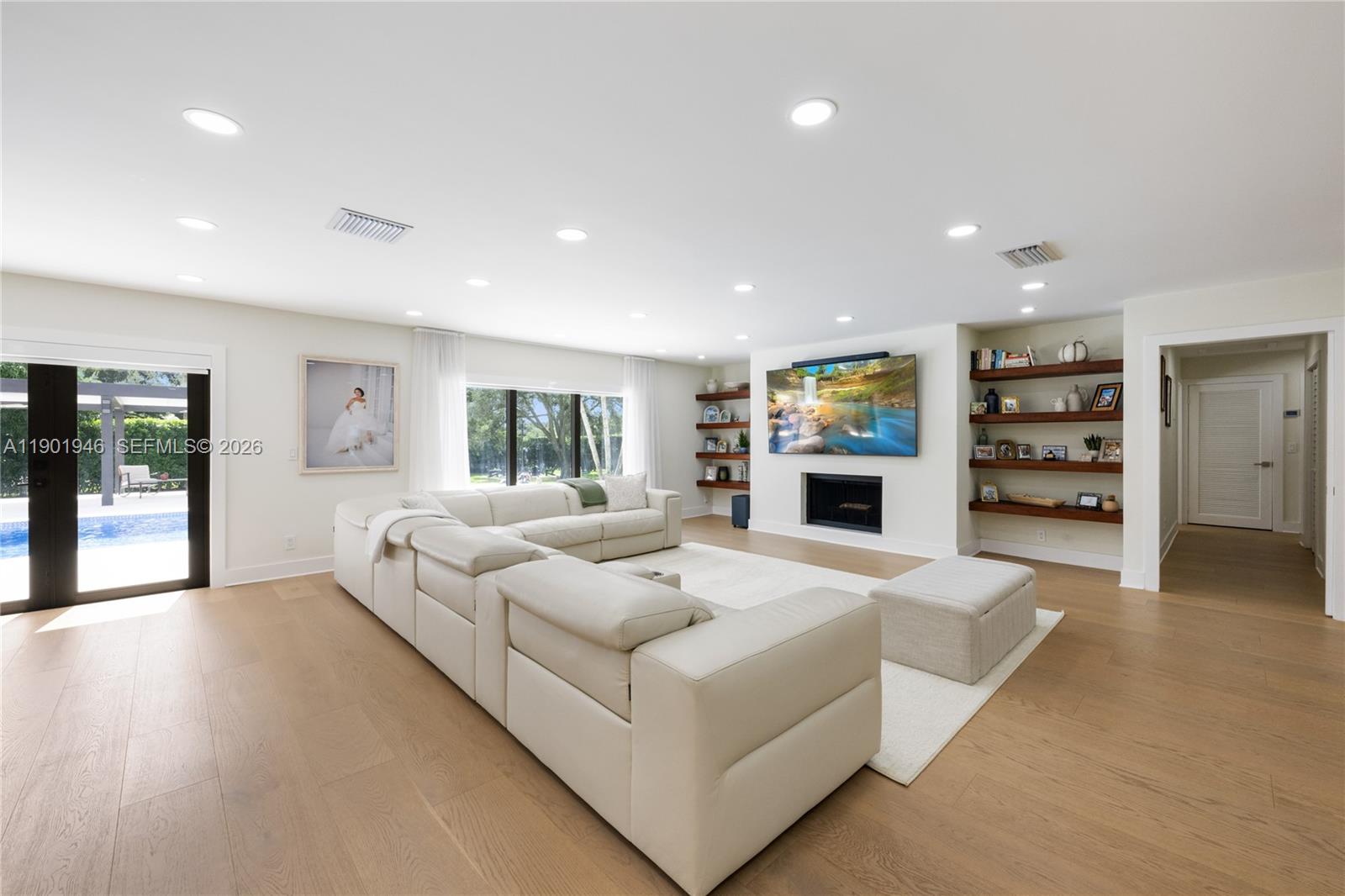 15110 North Saxon Circle Southwest Ranches, FL 33331 - Photo 3 of 45 a living room with furniture and a flat screen tv