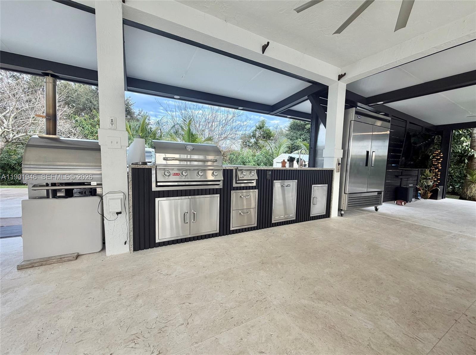 15110 North Saxon Circle Southwest Ranches, FL 33331 - Photo 33 of 45 a view of a kitchen with a sink and large window