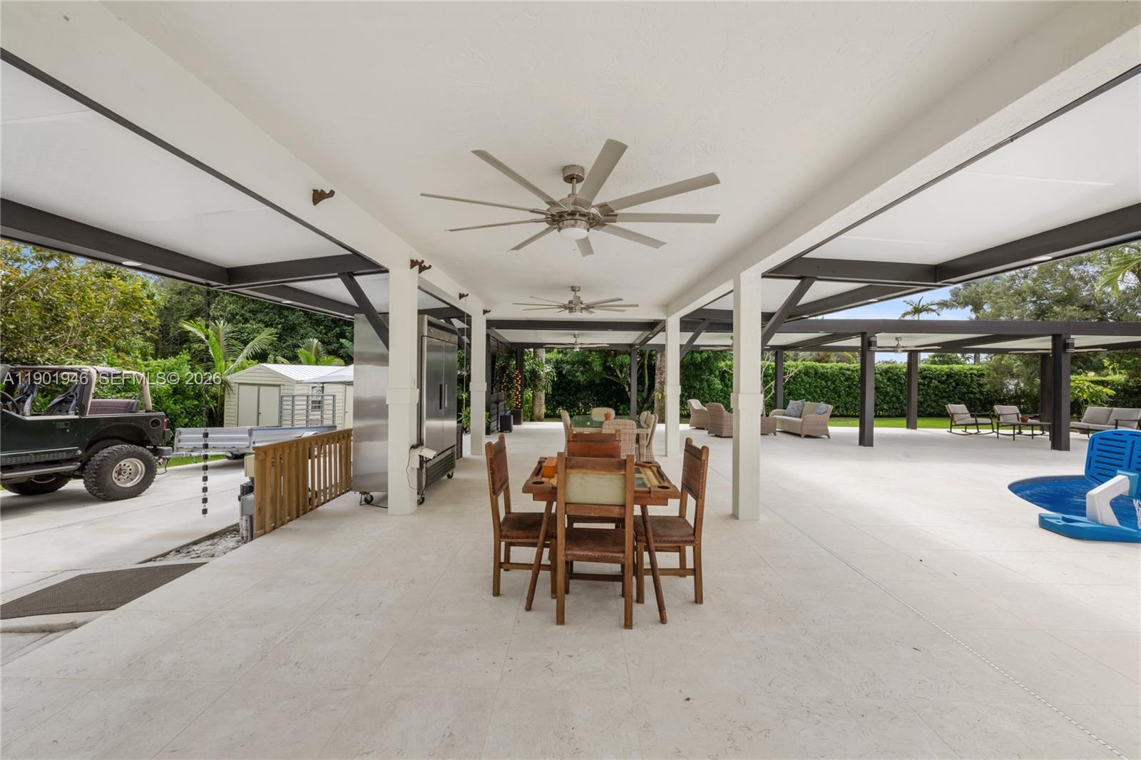 15110 North Saxon Circle Southwest Ranches, FL 33331 - Photo 35 of 45 a view of a patio with a table and chairs