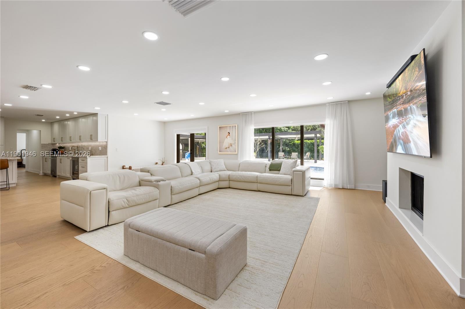 15110 North Saxon Circle Southwest Ranches, FL 33331 - Photo 4 of 45 a living room with furniture and a fireplace