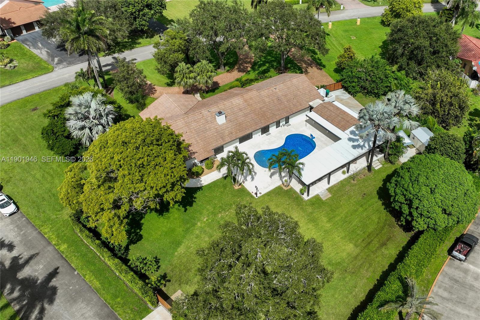 15110 North Saxon Circle Southwest Ranches, FL 33331 - Photo 43 of 45 an aerial view of a house with a yard and outdoor seating