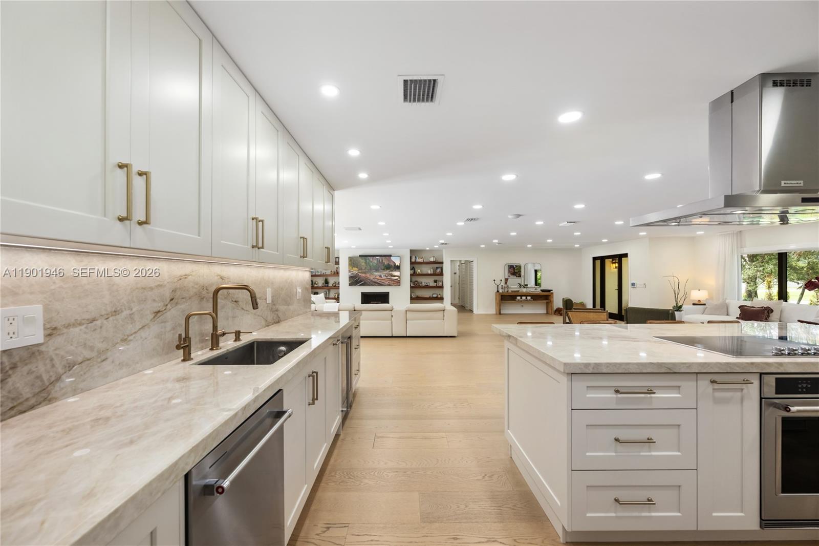 15110 North Saxon Circle Southwest Ranches, FL 33331 - Photo 7 of 45 a large kitchen with granite countertop lots of counter space and a sink