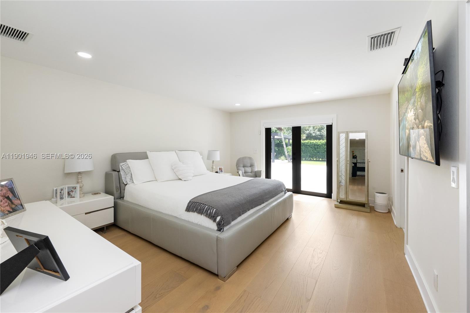 15110 North Saxon Circle Southwest Ranches, FL 33331 - Photo 10 of 45 a spacious bedroom with a bed and large window