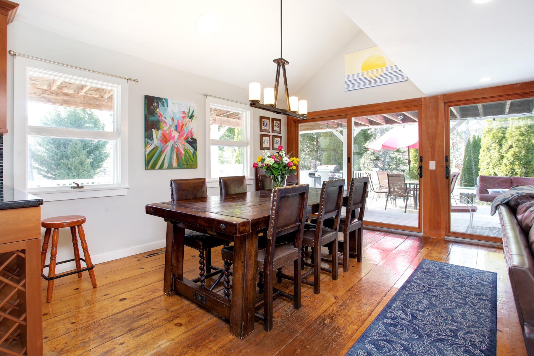 21 5 Corners Road Centerville, MA 02632 - Photo 13 of 38 a view of a dining room with furniture a rug and wooden floor