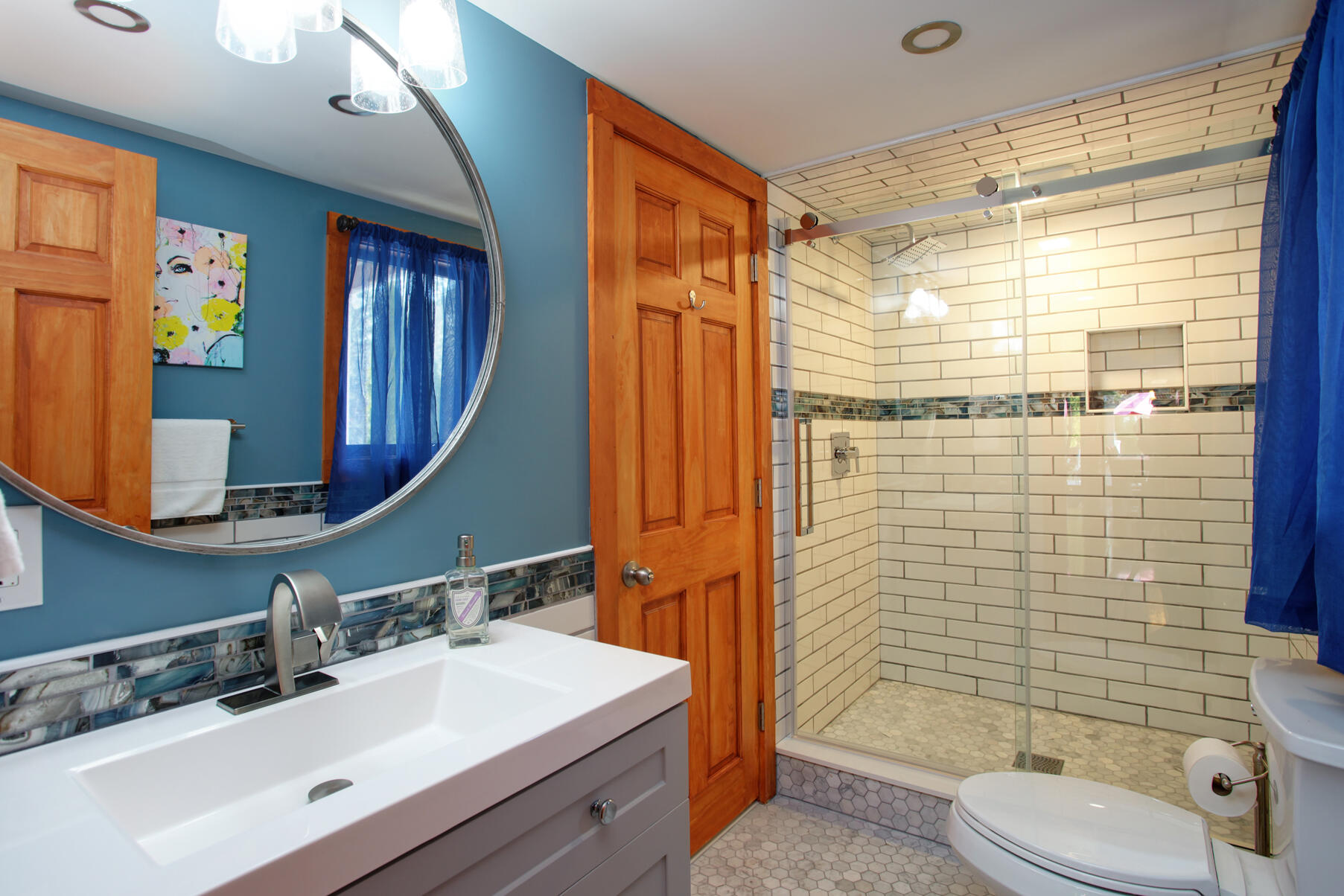 21 5 Corners Road Centerville, MA 02632 - Photo 20 of 38 a bathroom with a sink vanity mirror and toilet