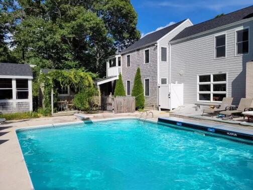 21 5 Corners Road Centerville, MA 02632 - Photo 2 of 38 a view of a house with backyard and sitting area