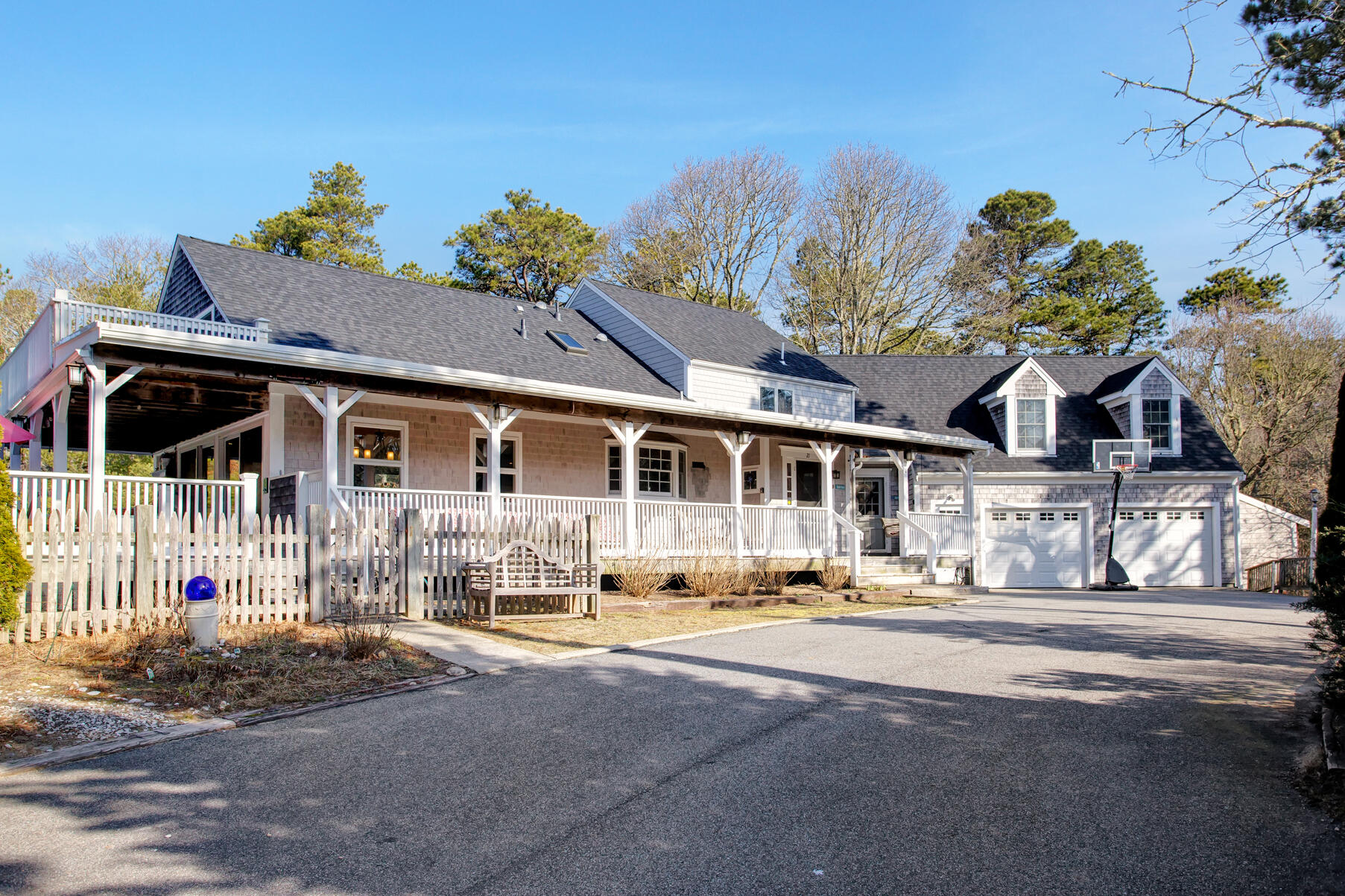21 5 Corners Road Centerville, MA 02632 - Photo 3 of 38 a front view of a house with a yard