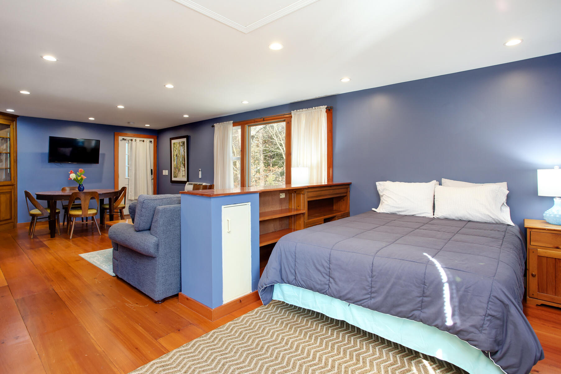 21 5 Corners Road Centerville, MA 02632 - Photo 33 of 38 a spacious bedroom with a bed and glass windows