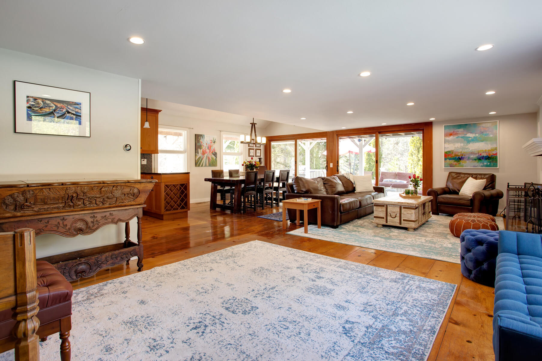 21 5 Corners Road Centerville, MA 02632 - Photo 6 of 38 a living room with furniture a rug kitchen view and a large window