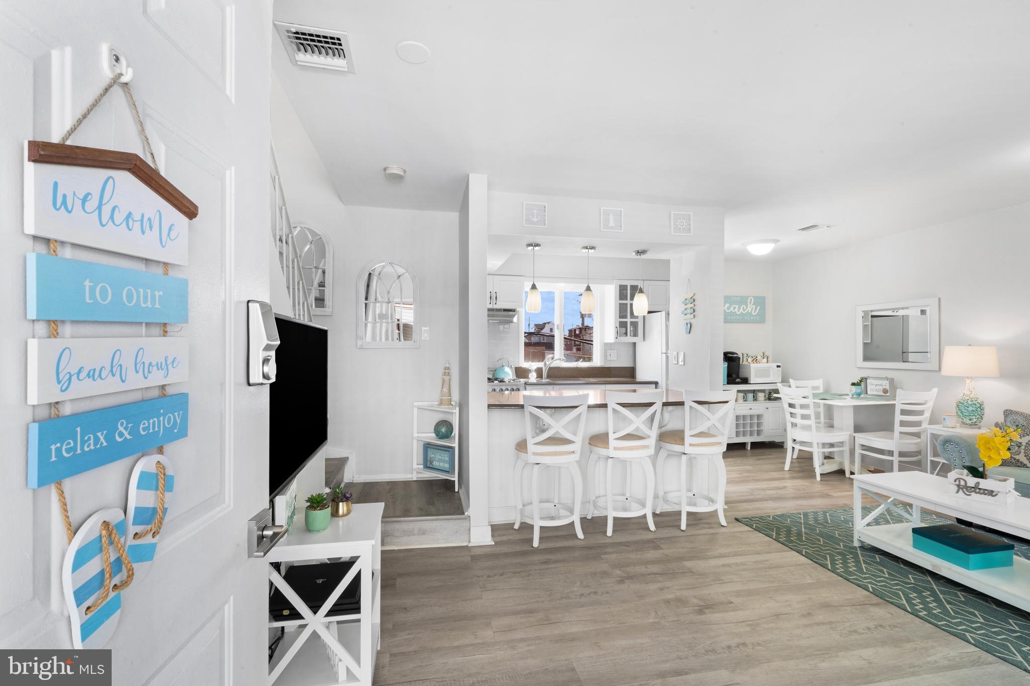 1709 Highway 35, Unit 9 Seaside Heights, NJ 08751 - Photo 1 of 28 a living room with stainless steel appliances kitchen island granite countertop furniture and a fireplace
