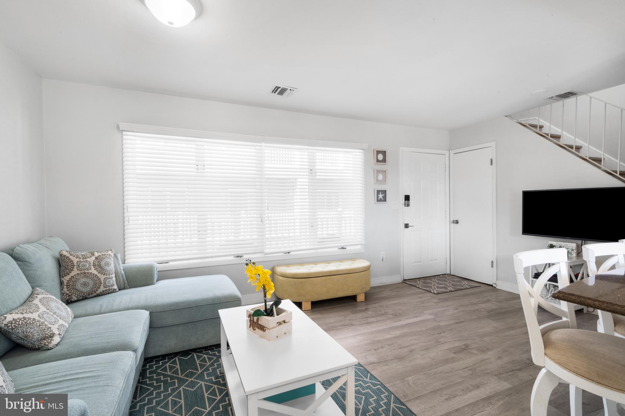 1709 Highway 35, Unit 9 Seaside Heights, NJ 08751 - Photo 11 of 28 a living room with furniture and a flat screen tv