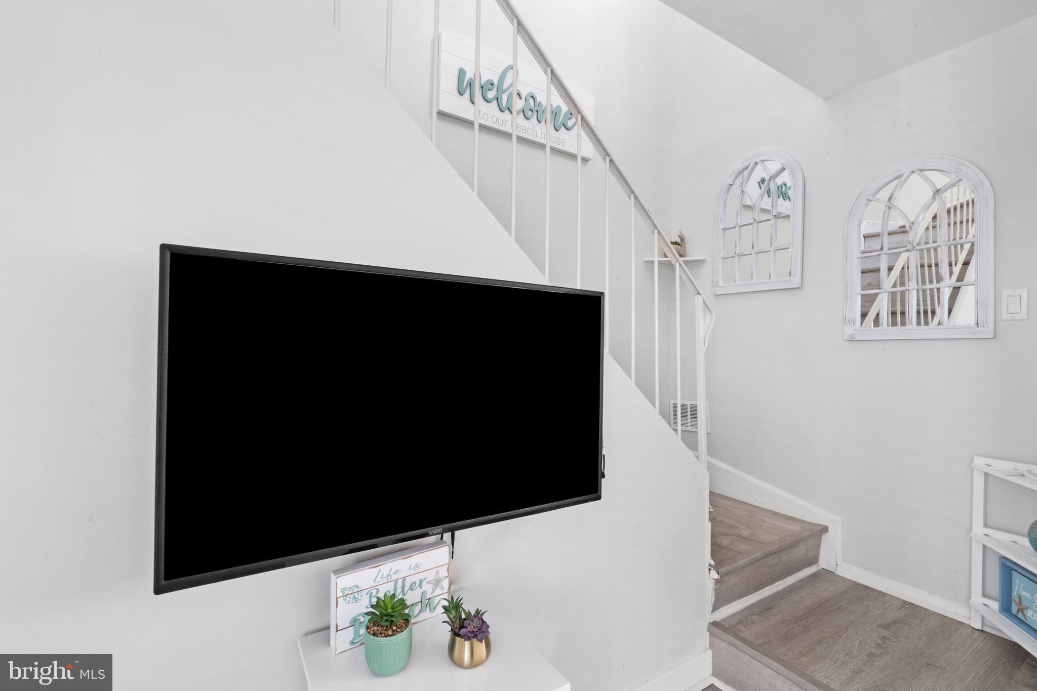 1709 Highway 35, Unit 9 Seaside Heights, NJ 08751 - Photo 12 of 28 a living room with furniture and a flat screen tv