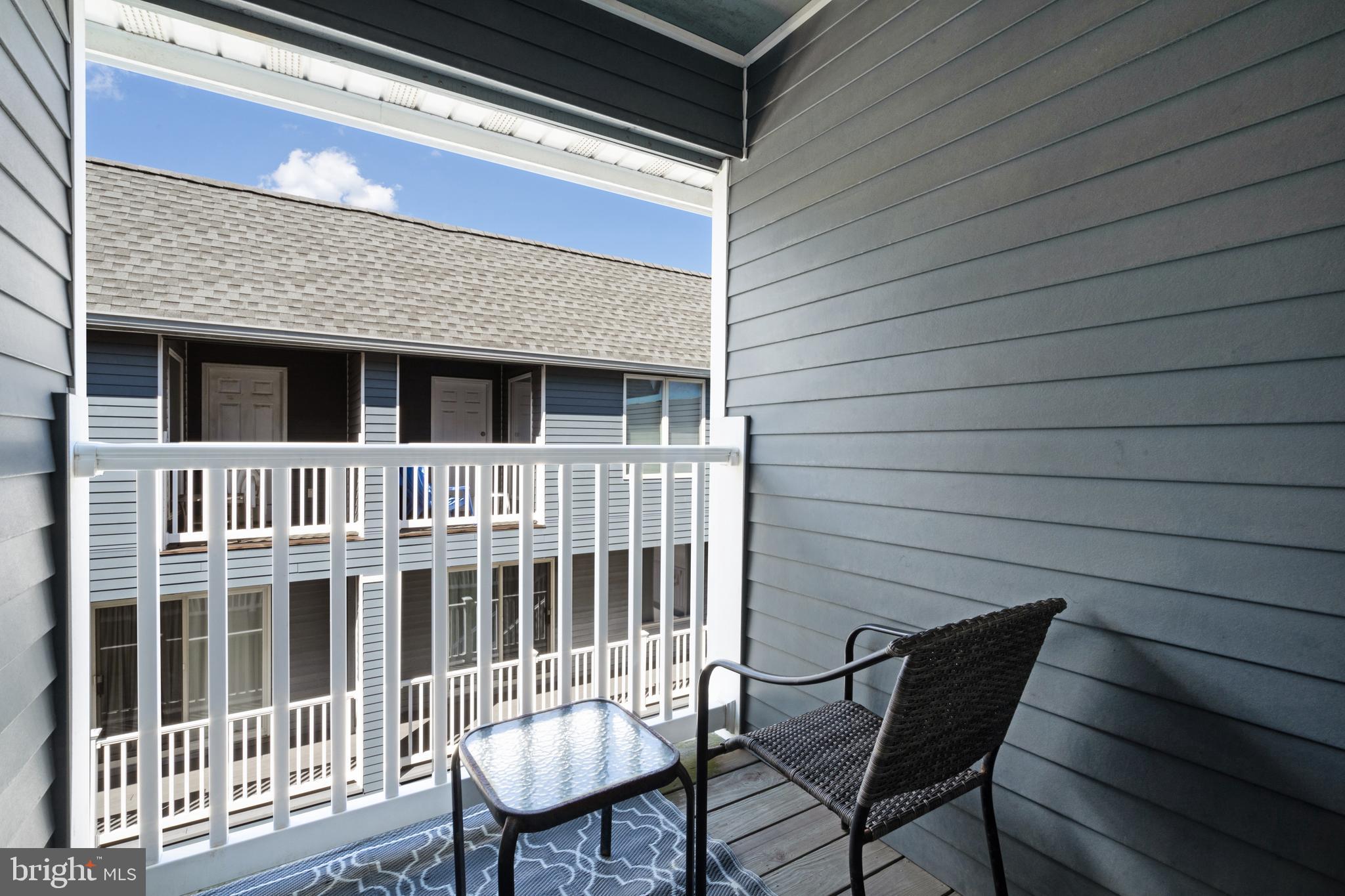 1709 Highway 35, Unit 9 Seaside Heights, NJ 08751 - Photo 14 of 28 a view of a chair and table in the roof deck