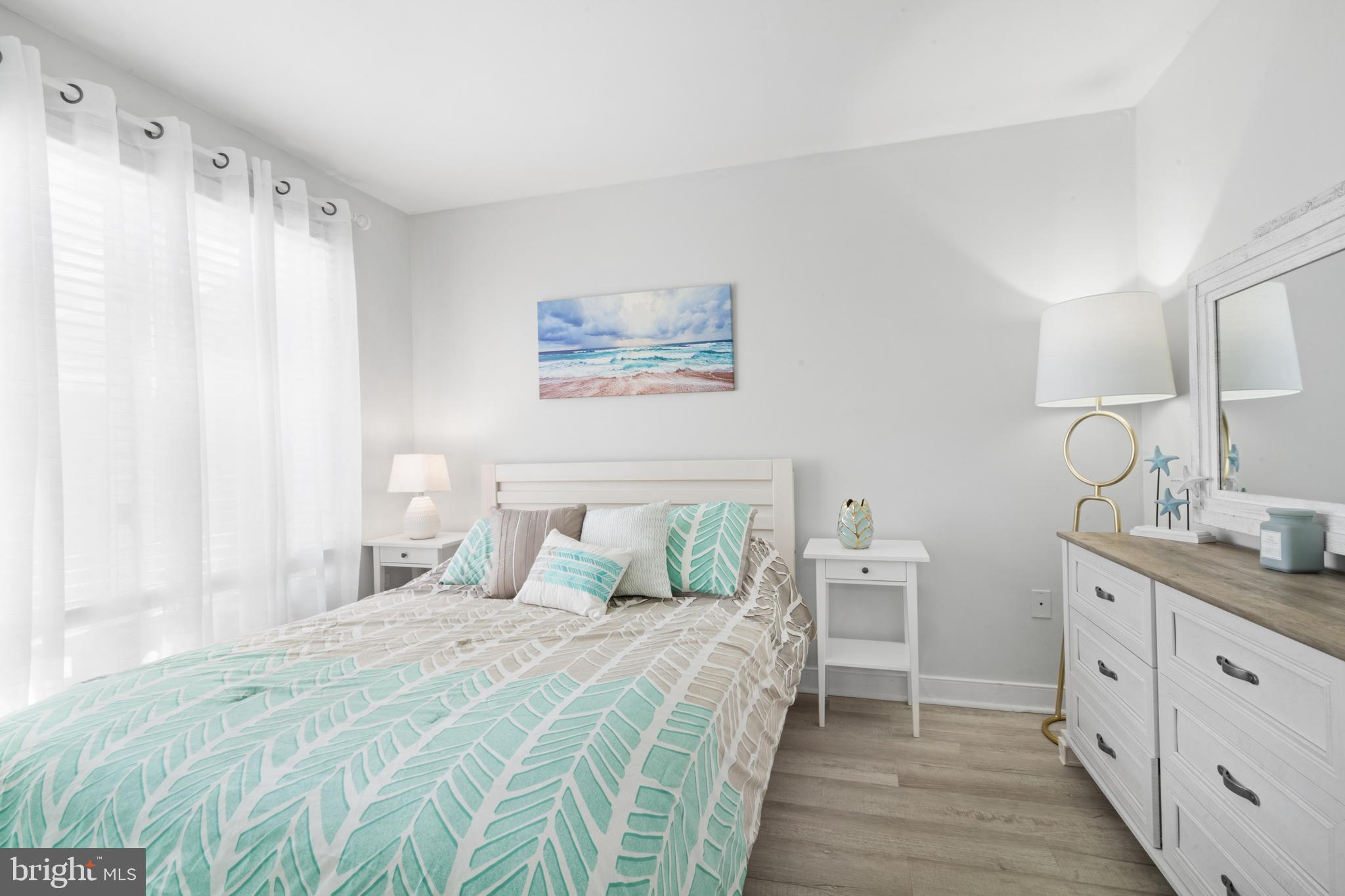 1709 Highway 35, Unit 9 Seaside Heights, NJ 08751 - Photo 16 of 28 a bedroom with a large bed and a window