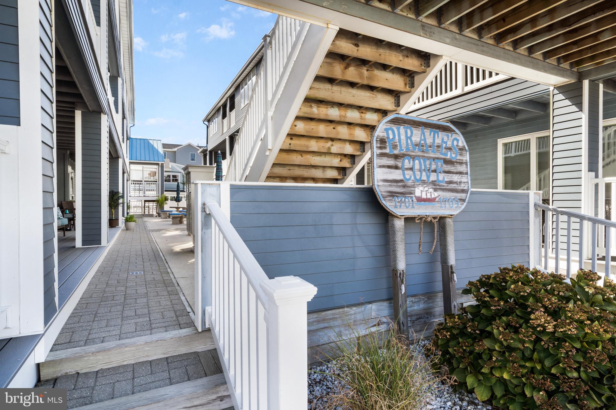 1709 Highway 35, Unit 9 Seaside Heights, NJ 08751 - Photo 24 of 28 a front view of a house with wooden stairs