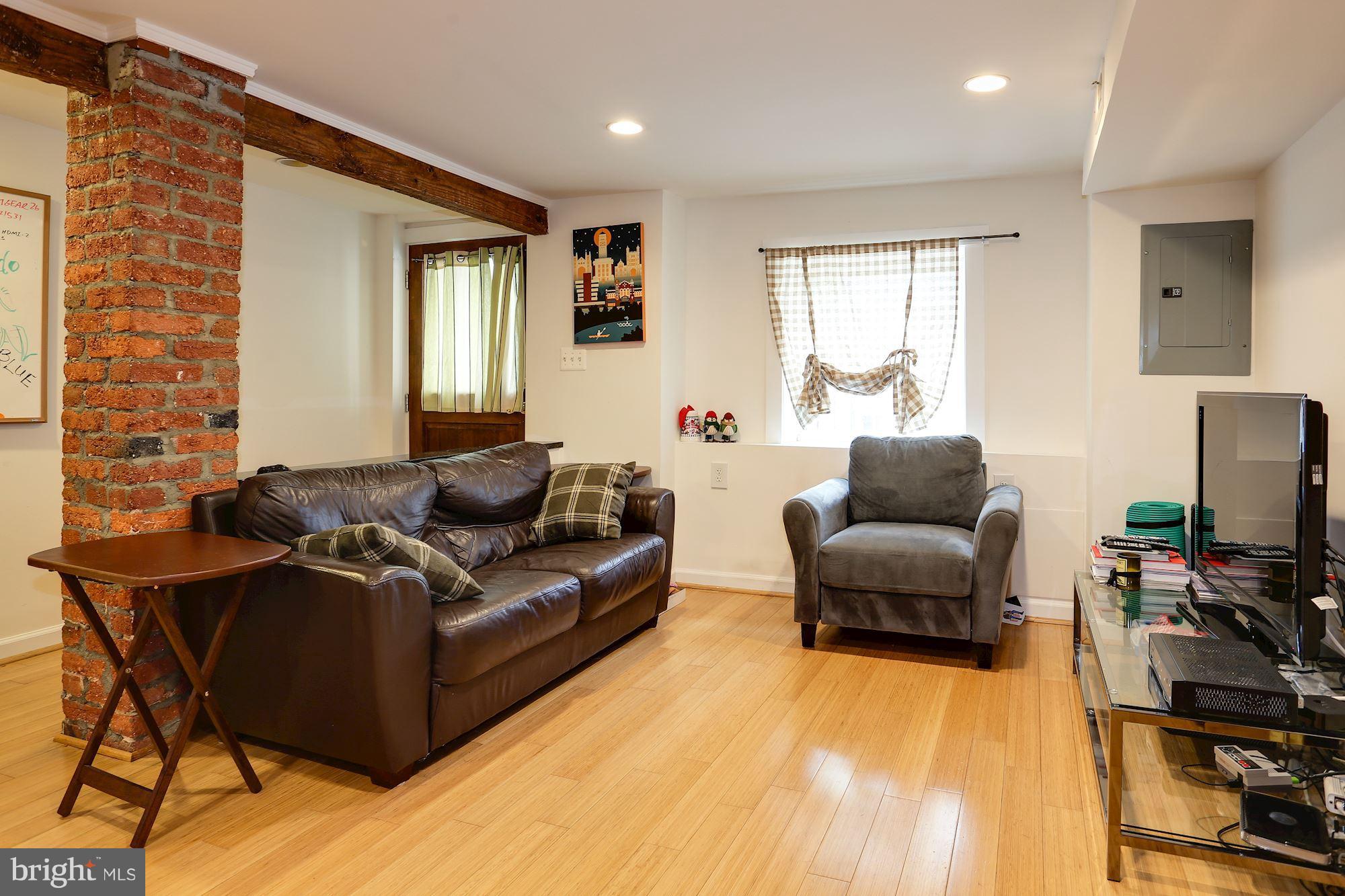 2323 Ontario Road Northwest, Unit 2 Washington, DC 20009 - Photo 2 of 13 Living Room w exposed brick walls