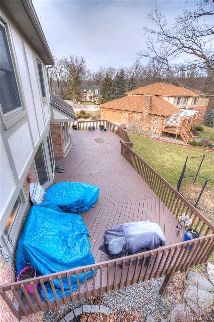 3140 Quail Ridge Circle Rochester, MI 48309 - Photo 12 of 45 Enjoy the relaxing view of the River on the HUGE deck!