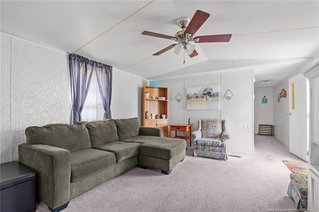 5236-5240 Maxwell Road Stedman, NC 28391 - Photo 12 of 50 a living room with furniture and a window