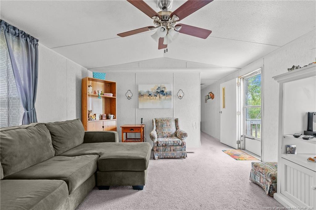 5236-5240 Maxwell Road Stedman, NC 28391 - Photo 13 of 50 a living room with furniture and a large window