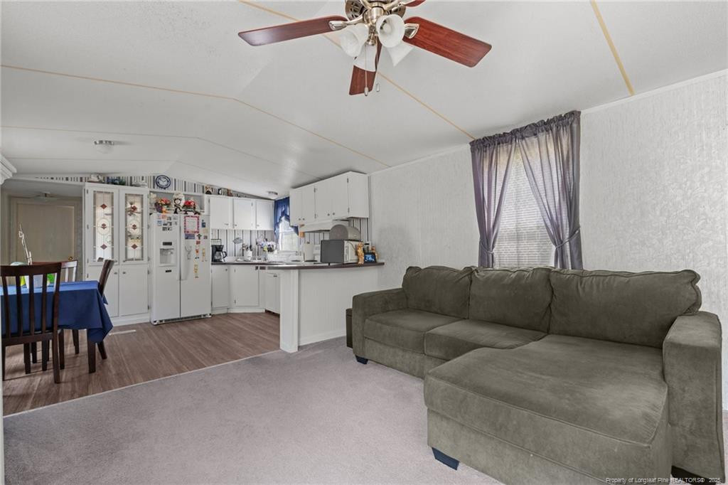 5236-5240 Maxwell Road Stedman, NC 28391 - Photo 14 of 50 a living room with furniture and kitchen view