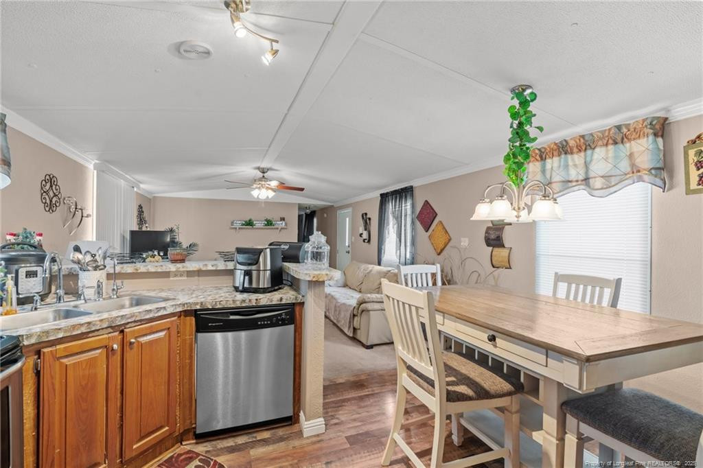 5236-5240 Maxwell Road Stedman, NC 28391 - Photo 19 of 50 a kitchen with granite countertop a table chairs stove and cabinets