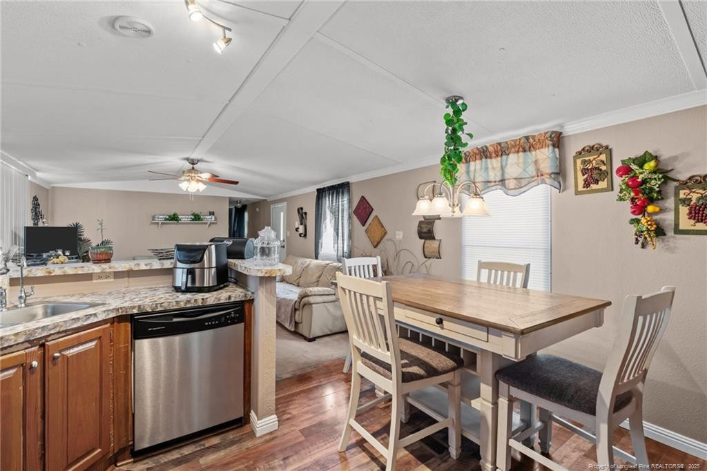 5236-5240 Maxwell Road Stedman, NC 28391 - Photo 22 of 50 a kitchen with a table and chairs in it