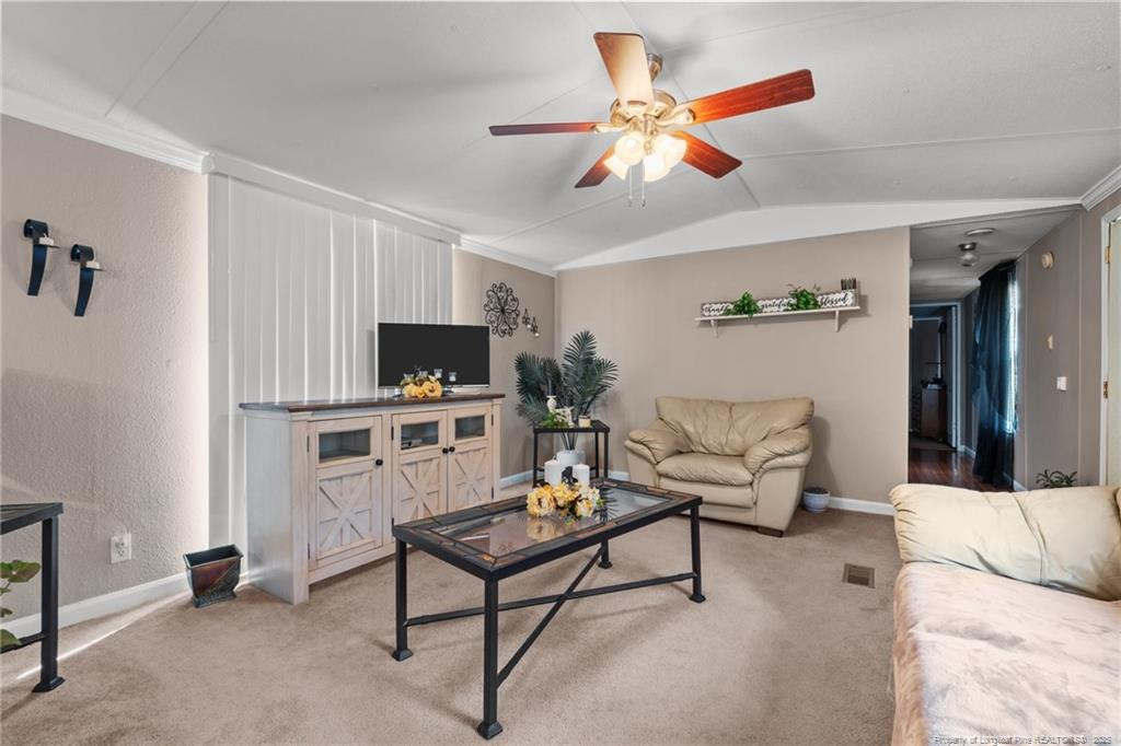 5236-5240 Maxwell Road Stedman, NC 28391 - Photo 24 of 50 a living room with furniture and a flat screen tv