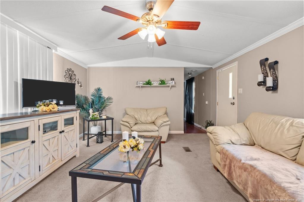 5236-5240 Maxwell Road Stedman, NC 28391 - Photo 25 of 50 a living room with furniture and a flat screen tv