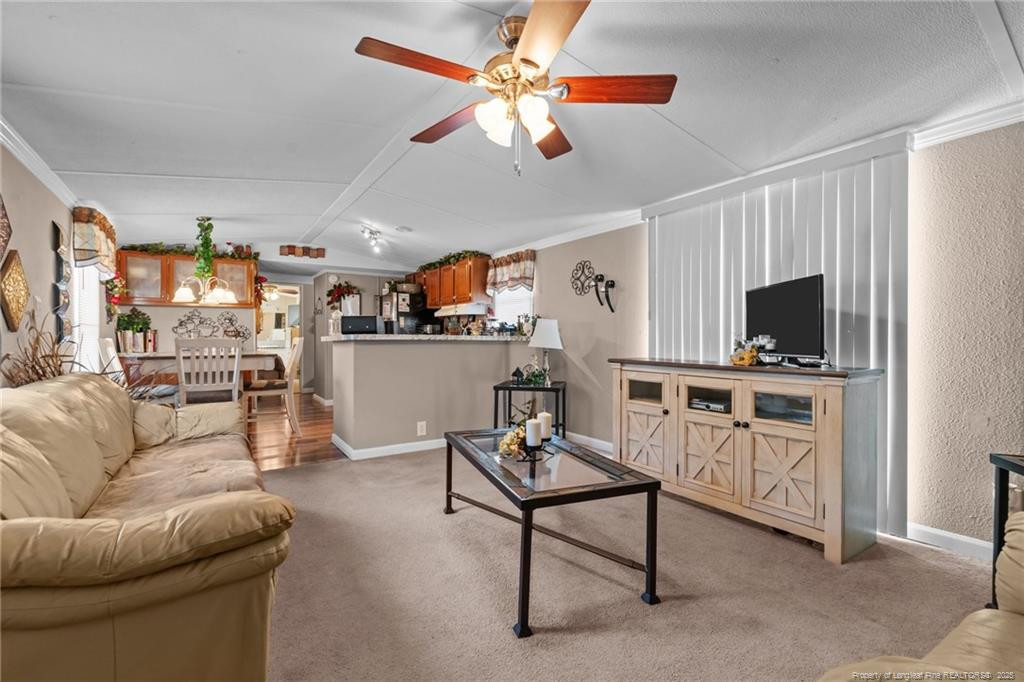 5236-5240 Maxwell Road Stedman, NC 28391 - Photo 27 of 50 a living room with furniture and a flat screen tv