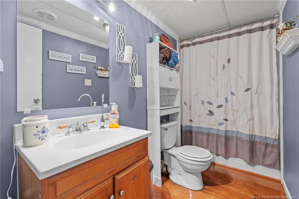 5236-5240 Maxwell Road Stedman, NC 28391 - Photo 29 of 50 a bathroom with a sink toilet and shower