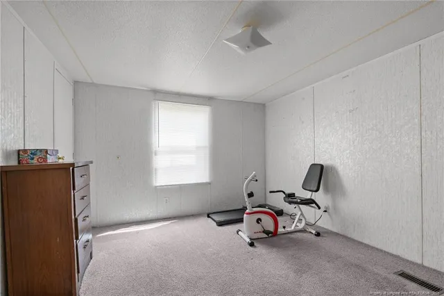 a room with a window and gym equipment