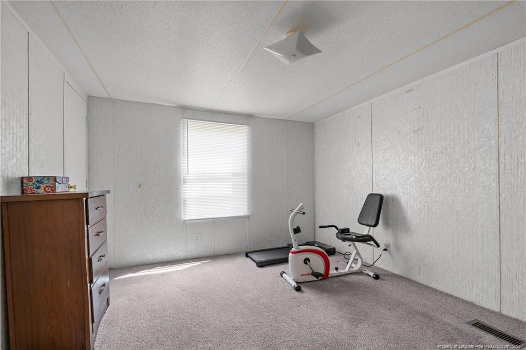 5236-5240 Maxwell Road Stedman, NC 28391 - Photo 3 of 50 a room with a window and gym equipment