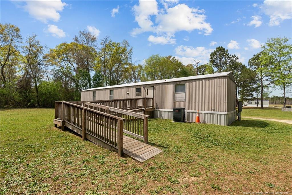 5236-5240 Maxwell Road Stedman, NC 28391 - Photo 32 of 50 a view of backyard with trees and a barn