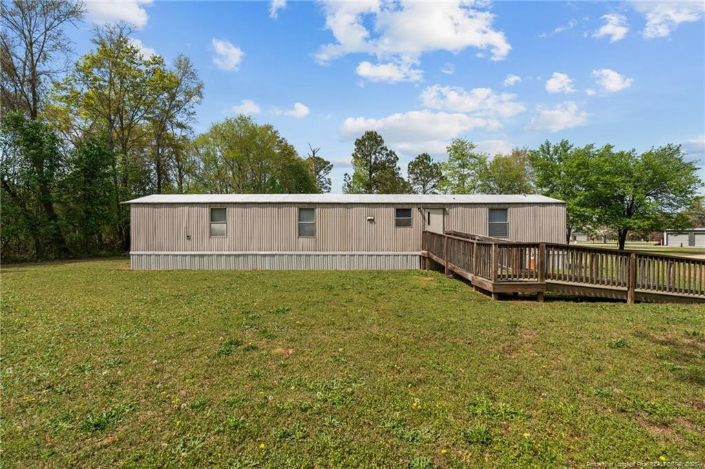 5236-5240 Maxwell Road Stedman, NC 28391 - Photo 33 of 50 a view of a house with a garden and trees