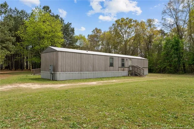 a view of a backyard with a trampoline
