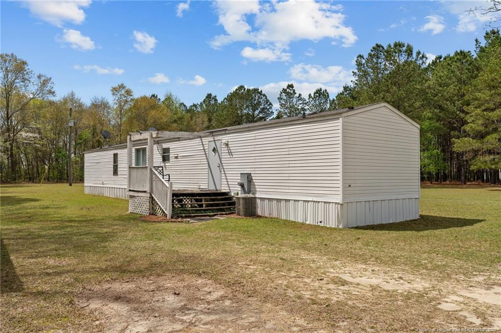 5236-5240 Maxwell Road Stedman, NC 28391 - Photo 40 of 50 a view of a house with a yard