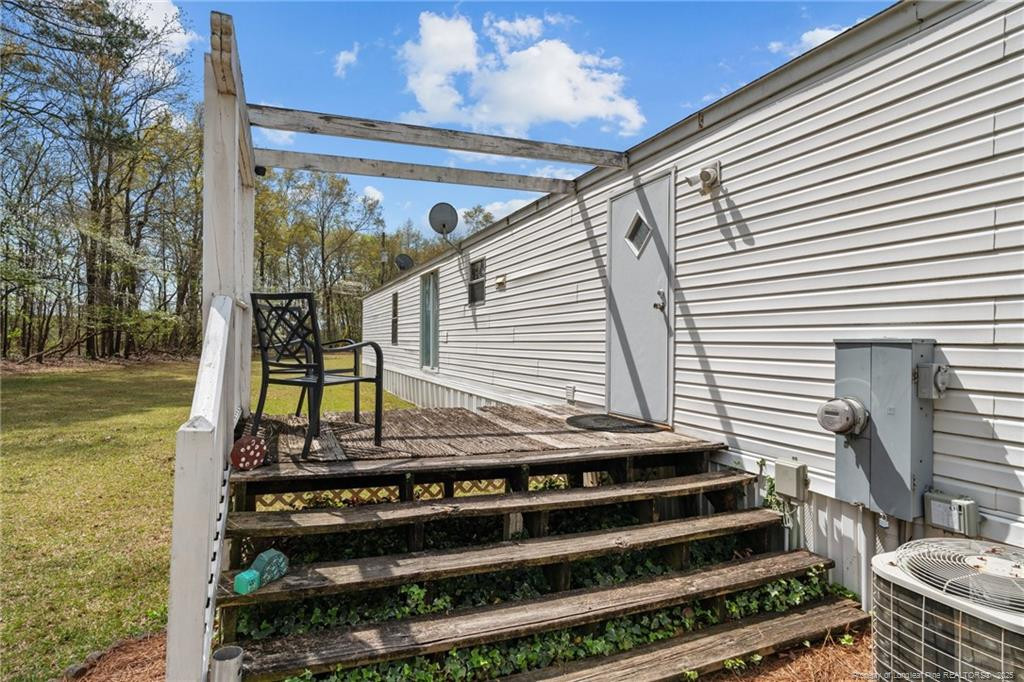 5236-5240 Maxwell Road Stedman, NC 28391 - Photo 41 of 50 a view of a balcony with chairs