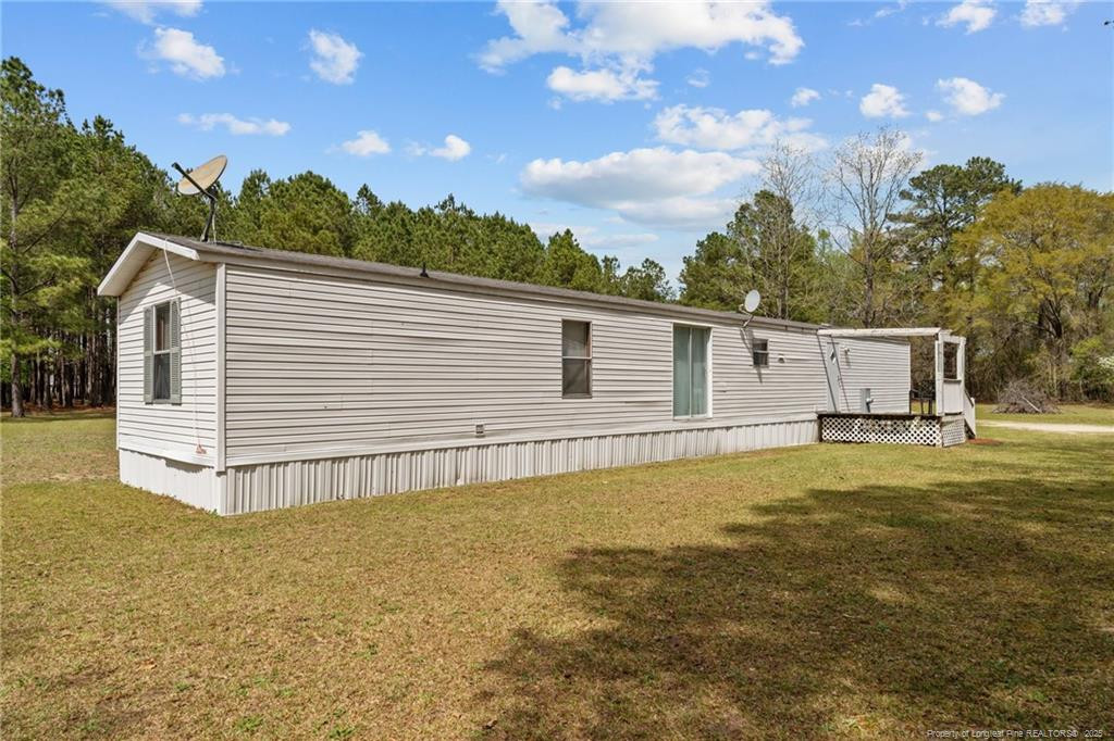 5236-5240 Maxwell Road Stedman, NC 28391 - Photo 42 of 50 a view of a house with a backyard