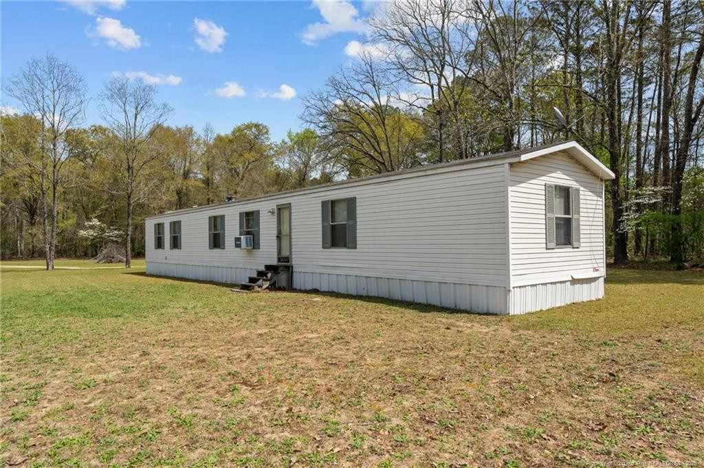 5236-5240 Maxwell Road Stedman, NC 28391 - Photo 43 of 50 a view of a house with a yard