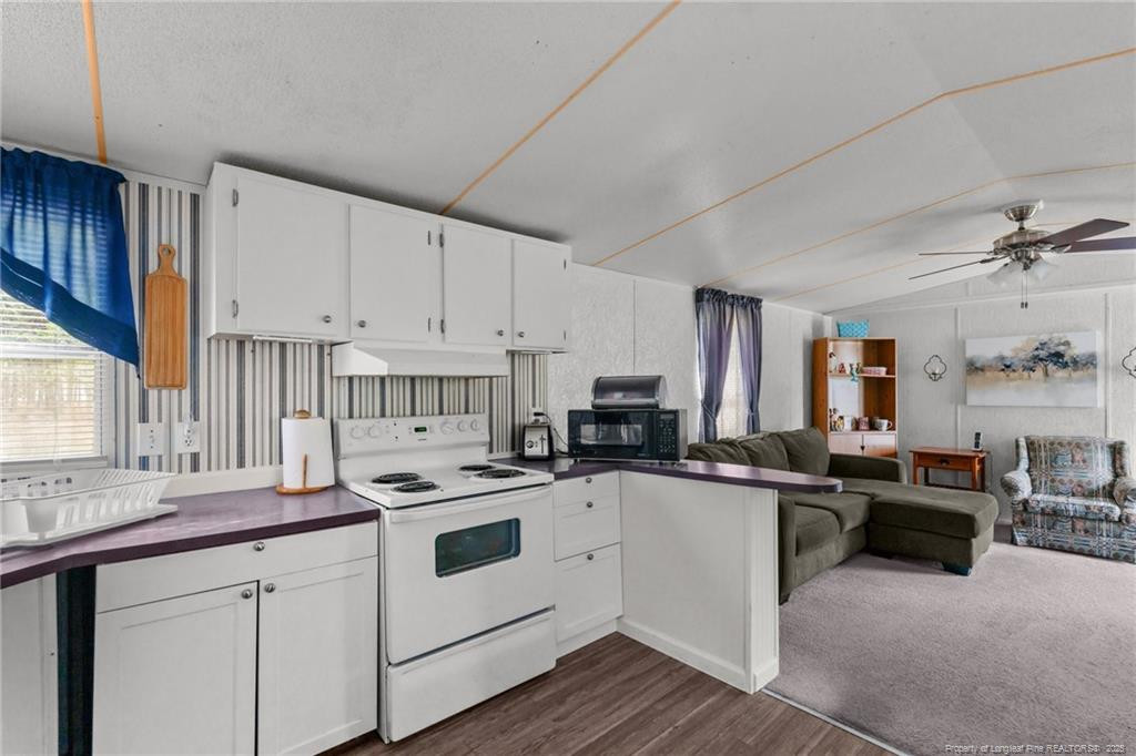 5236-5240 Maxwell Road Stedman, NC 28391 - Photo 8 of 50 a kitchen with white cabinets and appliances