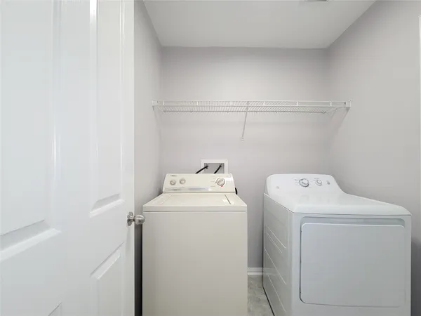 a utility room with dryer and washer