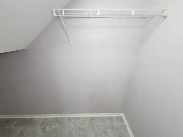 a view of a room with racks on the wall