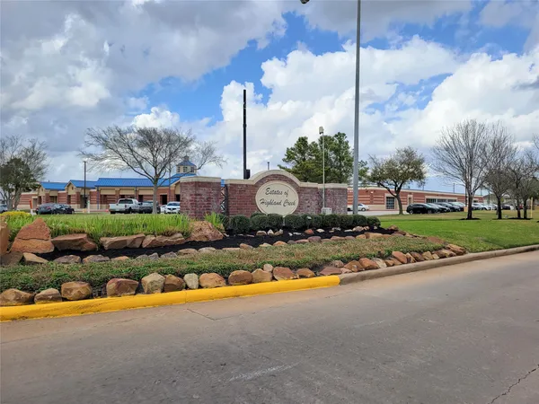 a view of a garden with iron fence