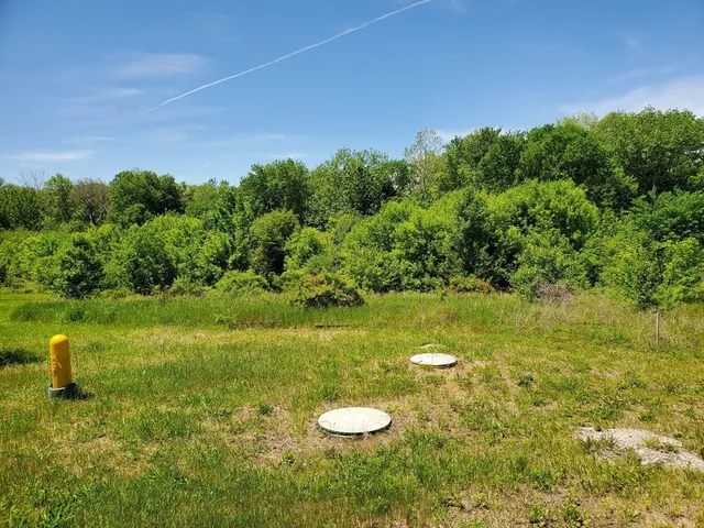 a view of a lake with a yard