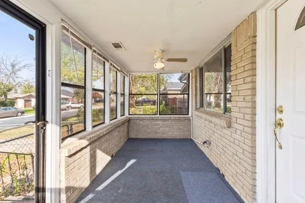 a view of an entryway with wooden floor