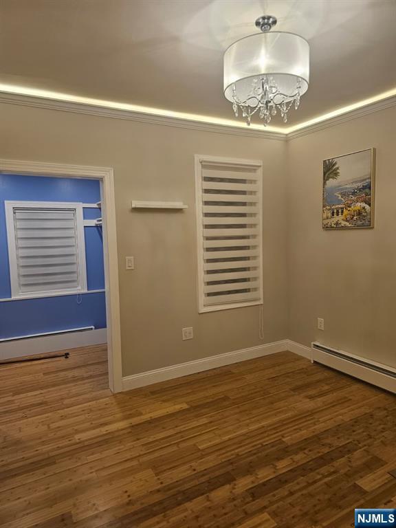 29 Willard Street, Unit 2 Garfield, NJ 07026 - Photo 12 of 21 a view of an empty room with a window and wooden floor