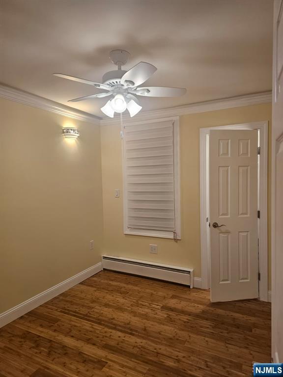 29 Willard Street, Unit 2 Garfield, NJ 07026 - Photo 19 of 21 a view of an empty room with wooden floor and a window