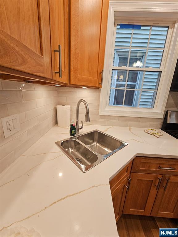 29 Willard Street, Unit 2 Garfield, NJ 07026 - Photo 5 of 21 a kitchen with granite countertop a sink a stove and cabinets