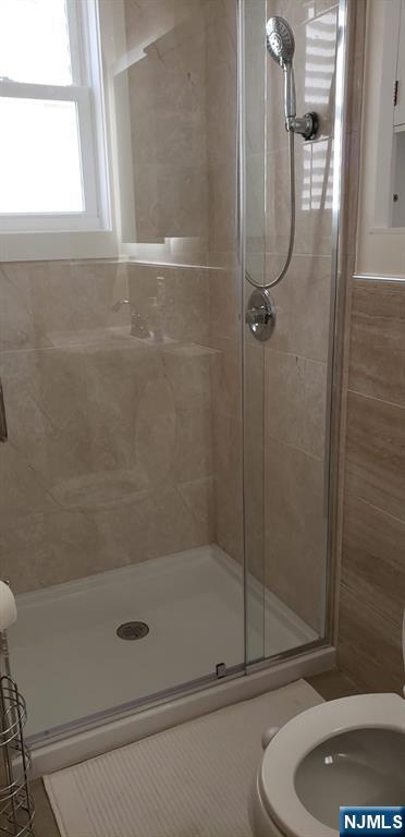 29 Willard Street, Unit 2 Garfield, NJ 07026 - Photo 10 of 21 a bathroom with a shower and a toilet